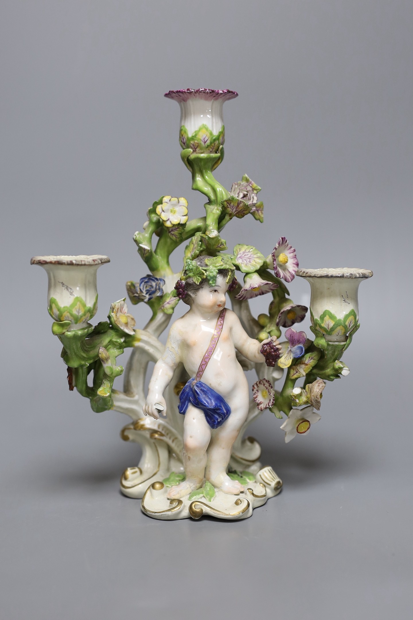 An 18th century English porcelain 3 branch candelabrum, probably Bow, 23cms high